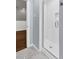 Bathroom featuring a tiled shower with a glass door at 7616 Valley Run Dr, Raleigh, NC 27615