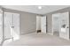 Carpeted bedroom with ceiling fan, and closet and bathroom access at 7616 Valley Run Dr, Raleigh, NC 27615