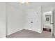 A cozy bedroom featuring a closet and an entry to an attached living space at 7616 Valley Run Dr, Raleigh, NC 27615