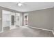 Neutral bedroom with carpet and access to bathroom and closet at 7616 Valley Run Dr, Raleigh, NC 27615