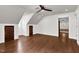 Spacious room with wood floors, white walls, and natural light at 7616 Valley Run Dr, Raleigh, NC 27615