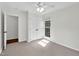A light filled bedroom features an entry to an attached bathroom and a spacious closet at 7616 Valley Run Dr, Raleigh, NC 27615