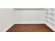 Bedroom features hardwood floors and white trim at 7616 Valley Run Dr, Raleigh, NC 27615