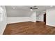 Bedroom boasts hardwood floors, white walls, and a ceiling fan at 7616 Valley Run Dr, Raleigh, NC 27615