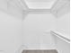 Walk-in closet with rods and shelving at 7616 Valley Run Dr, Raleigh, NC 27615