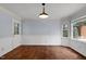 Empty dining area, freshly renovated, with hardwood floors and beautiful windows at 7616 Valley Run Dr, Raleigh, NC 27615