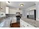 Contemporary kitchen with stainless steel appliances and granite countertops at 7616 Valley Run Dr, Raleigh, NC 27615