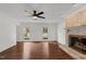 Spacious living room with a fireplace, hardwood floors, and ample natural light at 7616 Valley Run Dr, Raleigh, NC 27615