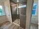 Bathroom featuring a glass enclosed shower and a view through the window to the outside at 779 Old Station Pointe, Angier, NC 27501