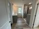 Modern bathroom with double vanity, stylish fixtures, and glass-enclosed shower for a spa-like experience at 779 Old Station Pointe, Angier, NC 27501