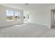 Expansive bedroom with plush carpeting, large windows offering plenty of natural light at 779 Old Station Pointe, Angier, NC 27501