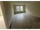 This bedroom features a large window to brighten the space at 779 Old Station Pointe, Angier, NC 27501