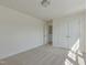 A bright bedroom with plush carpet, white trim, and a large closet at 779 Old Station Pointe, Angier, NC 27501
