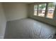 This bedroom has large windows to brighten the space at 779 Old Station Pointe, Angier, NC 27501