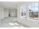 Open bonus room featuring two large windows, carpet, and access to more rooms at 779 Old Station Pointe, Angier, NC 27501