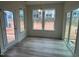 Bright breakfast nook featuring stylish lighting, large windows, and sliding glass door access at 779 Old Station Pointe, Angier, NC 27501