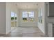 Open dining area with chandelier and large windows, providing views of the backyard at 779 Old Station Pointe, Angier, NC 27501