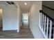 Inviting entryway with hardwood floors leading into a spacious open-concept living area at 779 Old Station Pointe, Angier, NC 27501