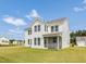Spacious two-story white home with a screened in porch and ample backyard at 779 Old Station Pointe, Angier, NC 27501