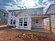 New two-story home exterior with ample windows, providing plenty of natural light at 779 Old Station Pointe, Angier, NC 27501