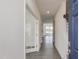 Bright foyer with hardwood floors, white trim, leading to an open-concept living area at 779 Old Station Pointe, Angier, NC 27501