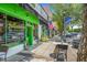 Exterior shot of Juicehaus with a bright green storefront, street seating, and a welcoming atmosphere at 779 Old Station Pointe, Angier, NC 27501