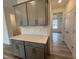 Stylish kitchen featuring shaker-style cabinets, white subway tile backsplash, and a pantry at 779 Old Station Pointe, Angier, NC 27501