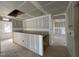 Under-construction living room with open layout, trimwork and access to an upper floor at 779 Old Station Pointe, Angier, NC 27501