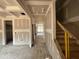 Spacious living room with under-construction coffered ceilings and an open layout at 779 Old Station Pointe, Angier, NC 27501