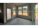 Bright under-construction living room with lots of natural light and access to outdoor living at 779 Old Station Pointe, Angier, NC 27501