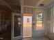 Bright under-construction living room with a door to outdoor living at 779 Old Station Pointe, Angier, NC 27501
