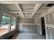 Under-construction living room with beautiful coffered ceilings, trimwork and natural light at 779 Old Station Pointe, Angier, NC 27501