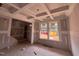 Bright living room with under-construction coffered ceiling and lots of natural light at 779 Old Station Pointe, Angier, NC 27501
