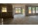 Spacious under-construction living room with trimwork and lots of natural light at 779 Old Station Pointe, Angier, NC 27501