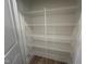 Spacious walk-in pantry with ample shelving for organized storage of groceries and kitchen essentials at 779 Old Station Pointe, Angier, NC 27501