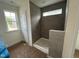 Bathroom featuring a modern tiled shower with a window for natural light at 779 Old Station Pointe, Angier, NC 27501