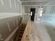 View of the staircase showing the route between the home's floors and a view through the home at 779 Old Station Pointe, Angier, NC 27501