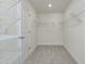 A large walk-in closet with wire shelving for ample storage space at 779 Old Station Pointe, Angier, NC 27501