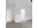 Bedroom with neutral carpet, showing entry doors to bathroom and closet at 812 East St, Smithfield, NC 27577