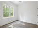 Neutral carpeted bedroom featuring a large window bringing the outdoors in at 812 East St, Smithfield, NC 27577