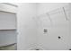 Spacious laundry room with washer and dryer hookups and wire shelving at 812 East St, Smithfield, NC 27577