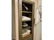 Bathroom built-in shelving with towels and decor at 817 Old Mill Rd, Chapel Hill, NC 27514