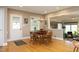 Dining room featuring hardwood floors, an updated light fixture, and access to living areas at 817 Old Mill Rd, Chapel Hill, NC 27514