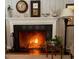 Close up of fireplace with decorative screen and mantel at 817 Old Mill Rd, Chapel Hill, NC 27514