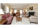 Spacious living room with fireplace, neutral color palette, and hardwood floors at 817 Old Mill Rd, Chapel Hill, NC 27514