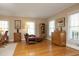 Bright living room featuring hardwood floors and traditional furnishings at 817 Old Mill Rd, Chapel Hill, NC 27514