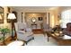 Cozy living room with hardwood floors, a fireplace, and seating area at 817 Old Mill Rd, Chapel Hill, NC 27514