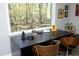 Close up of office desk with wood chairs overlooking scenic outdoor view at 817 Old Mill Rd, Chapel Hill, NC 27514