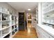 Spacious pantry with custom shelving for food and wine storage at 817 Old Mill Rd, Chapel Hill, NC 27514