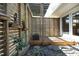 Landscaped outdoor space with wood patio, privacy fence, and sliding door entrance at 817 Old Mill Rd, Chapel Hill, NC 27514